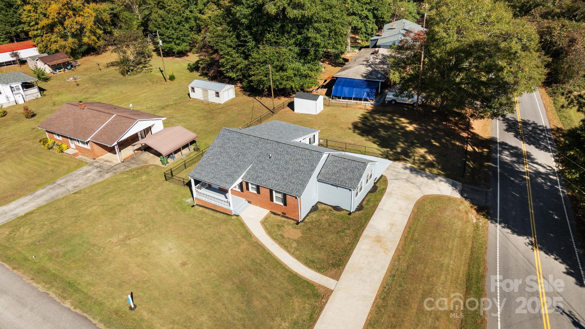 1804 Bennett Road Lancaster, SC 29720 - Photo 39 of 41 an aerial view of a house with swimming pool and large trees