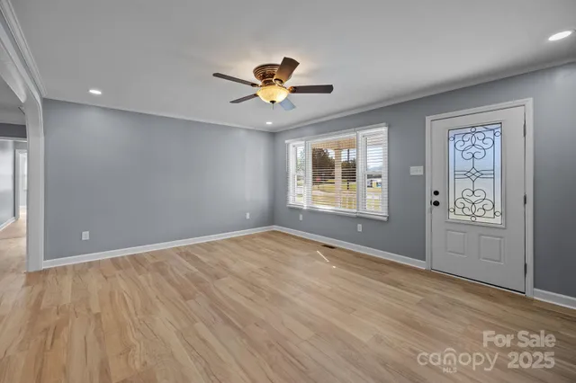 a view of an empty room with a window