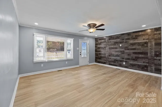 a view of an empty room with a window