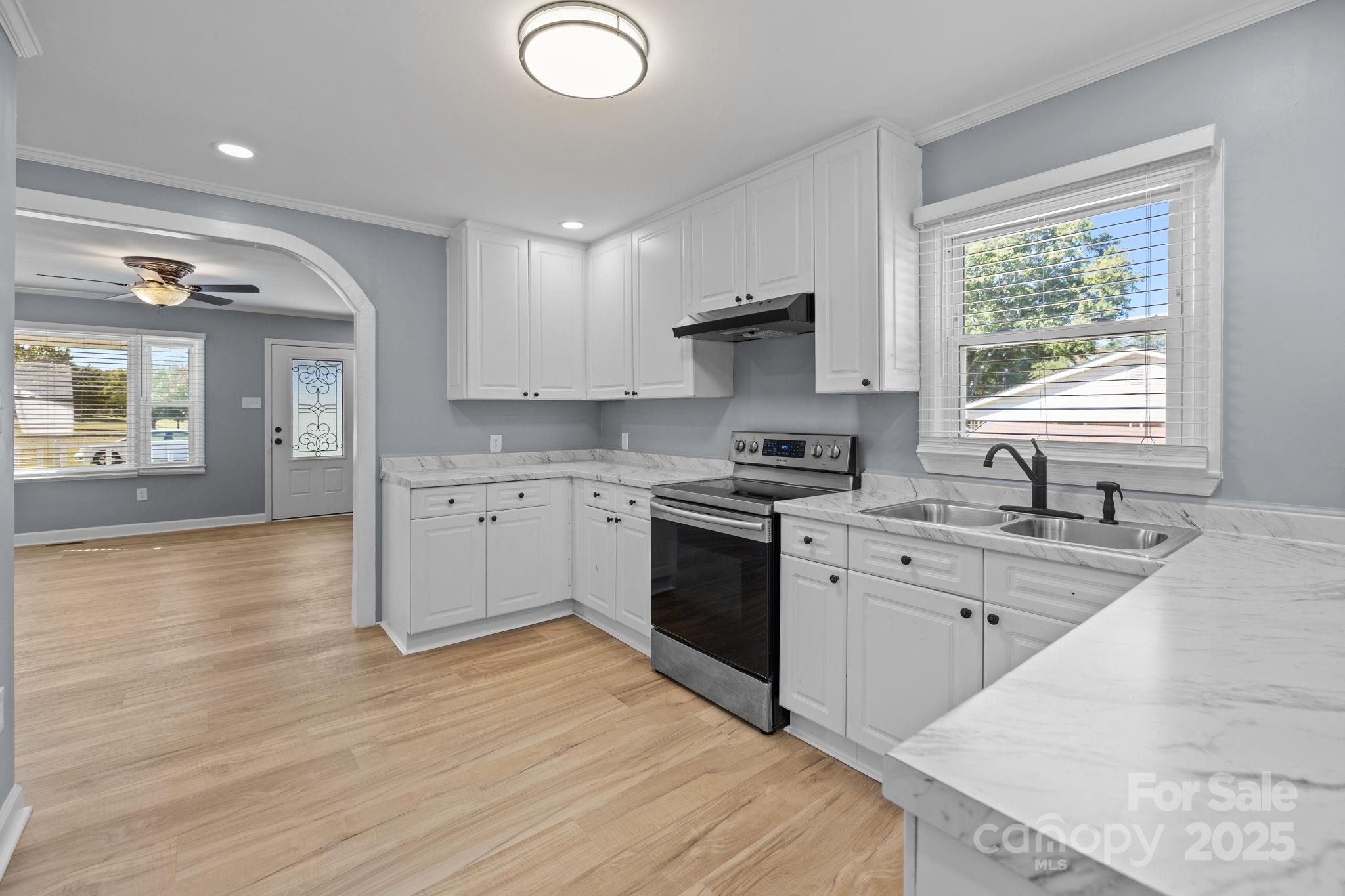 1804 Bennett Road Lancaster, SC 29720 - Photo 8 of 41 a kitchen with stainless steel appliances granite countertop a sink stove and refrigerator