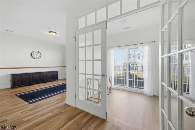 a view of entryway with wooden floor
