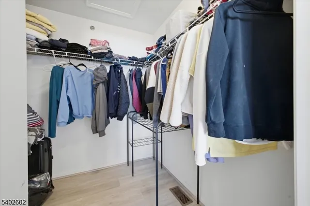 a bathroom with a sink a mirror and a shower curtain