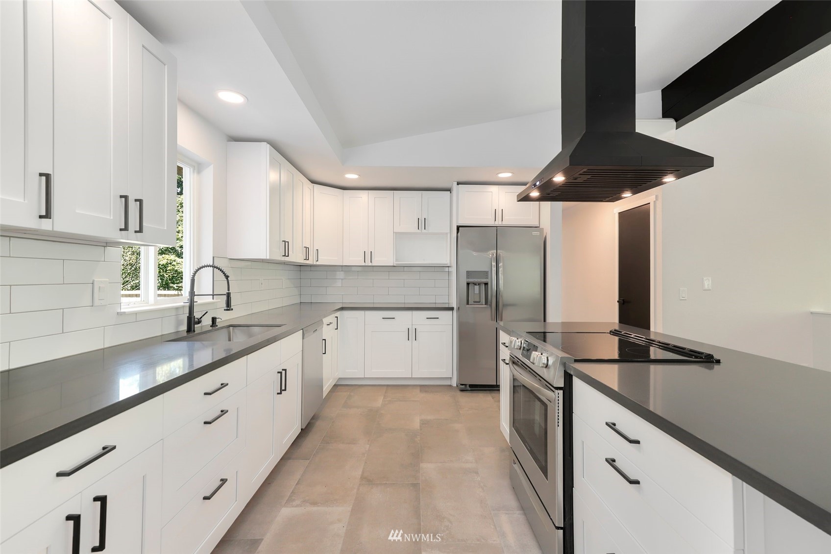 23314 25th Drive Southeast Bothell, WA 98021 - Photo 11 of 40 a kitchen with a sink a stove and cabinets