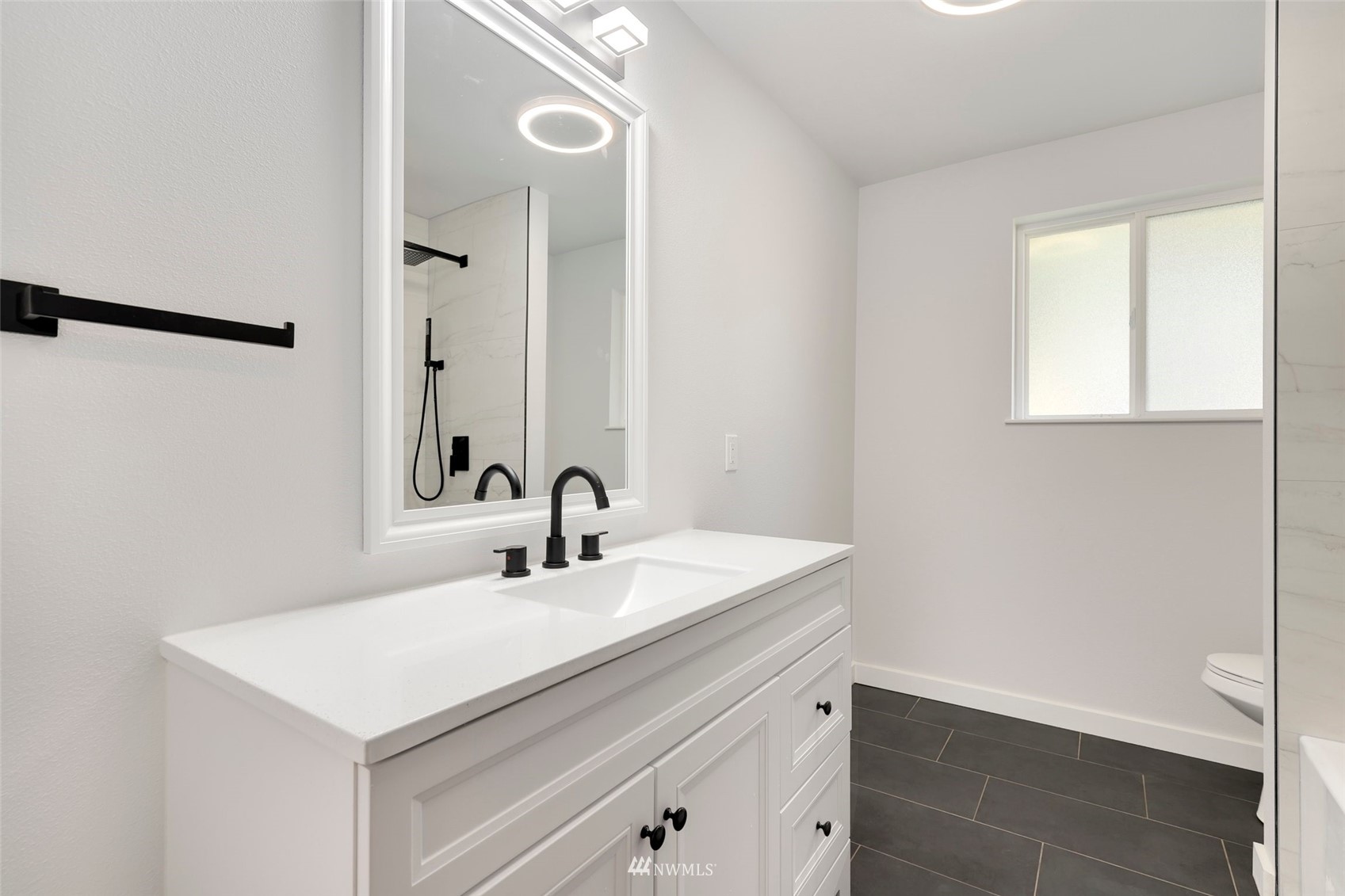 23314 25th Drive Southeast Bothell, WA 98021 - Photo 17 of 40 a bathroom with a sink and a mirror