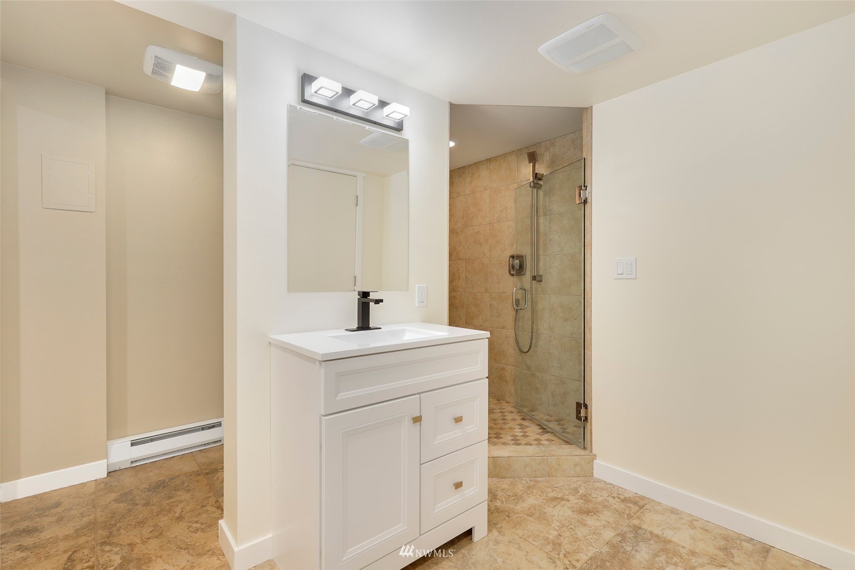 23314 25th Drive Southeast Bothell, WA 98021 - Photo 25 of 40 a view of bathroom with a sink mirror and shower