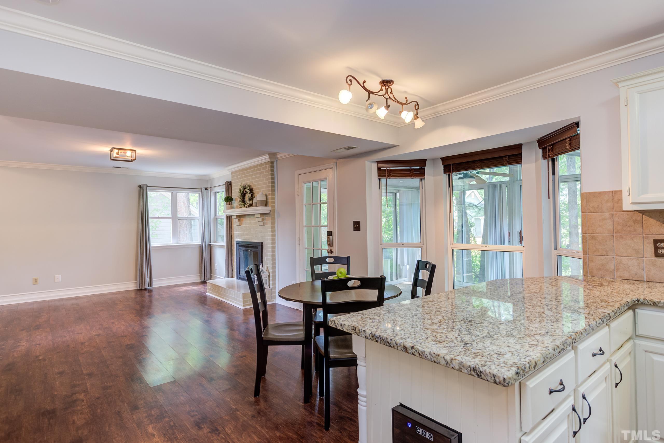 206 Eagle Tavern Drive Garner, NC 27529 - Photo 11 of 41 a view of center island kitchen island dining table and chairs