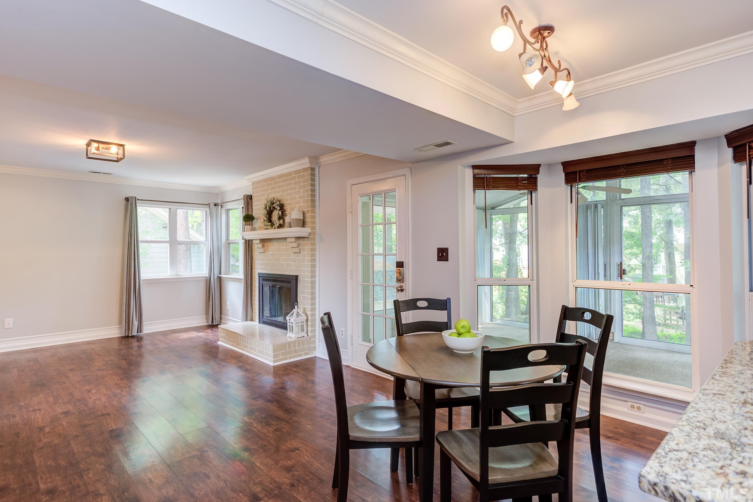 206 Eagle Tavern Drive Garner, NC 27529 - Photo 12 of 41 a view of a dining room with furniture window and wooden floor