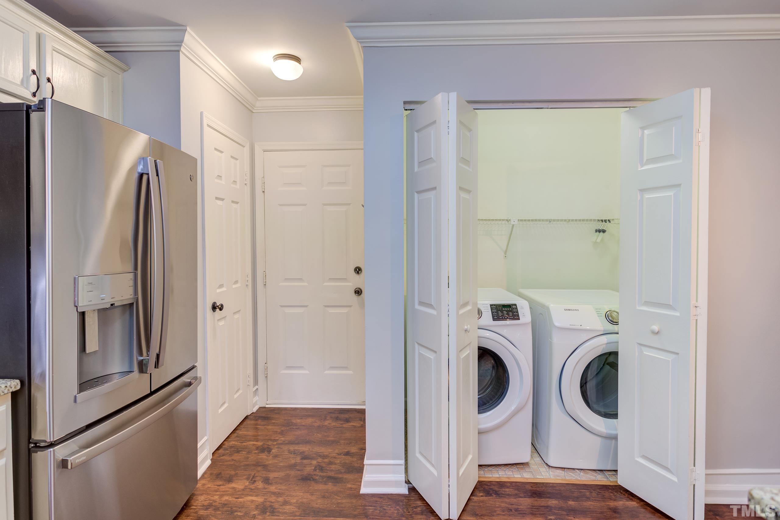 206 Eagle Tavern Drive Garner, NC 27529 - Photo 14 of 41 a view of a hallway with washer and dryer