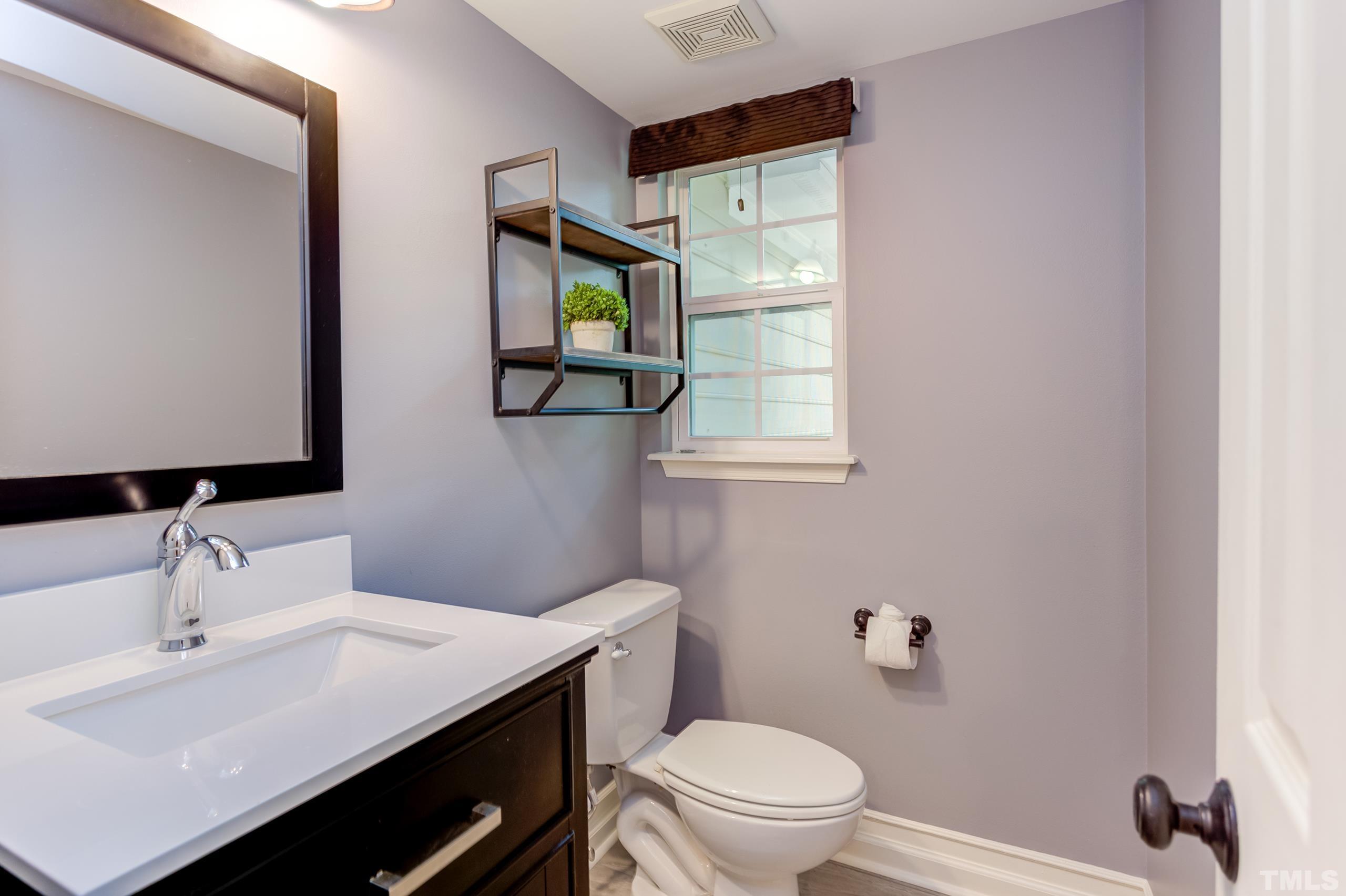 206 Eagle Tavern Drive Garner, NC 27529 - Photo 18 of 41 a bathroom with a sink toilet and mirror