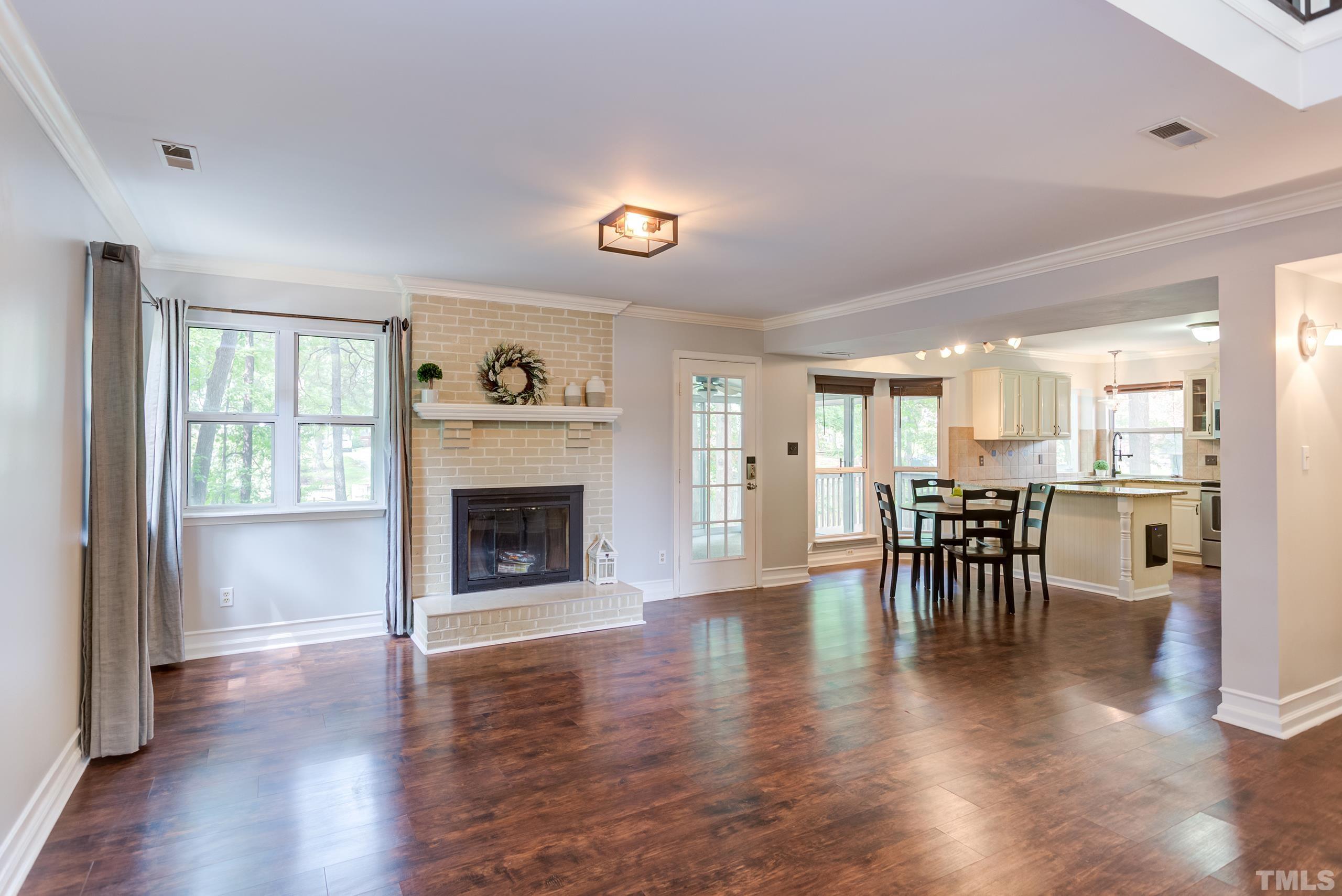 206 Eagle Tavern Drive Garner, NC 27529 - Photo 2 of 41 a living room with furniture and a fireplace