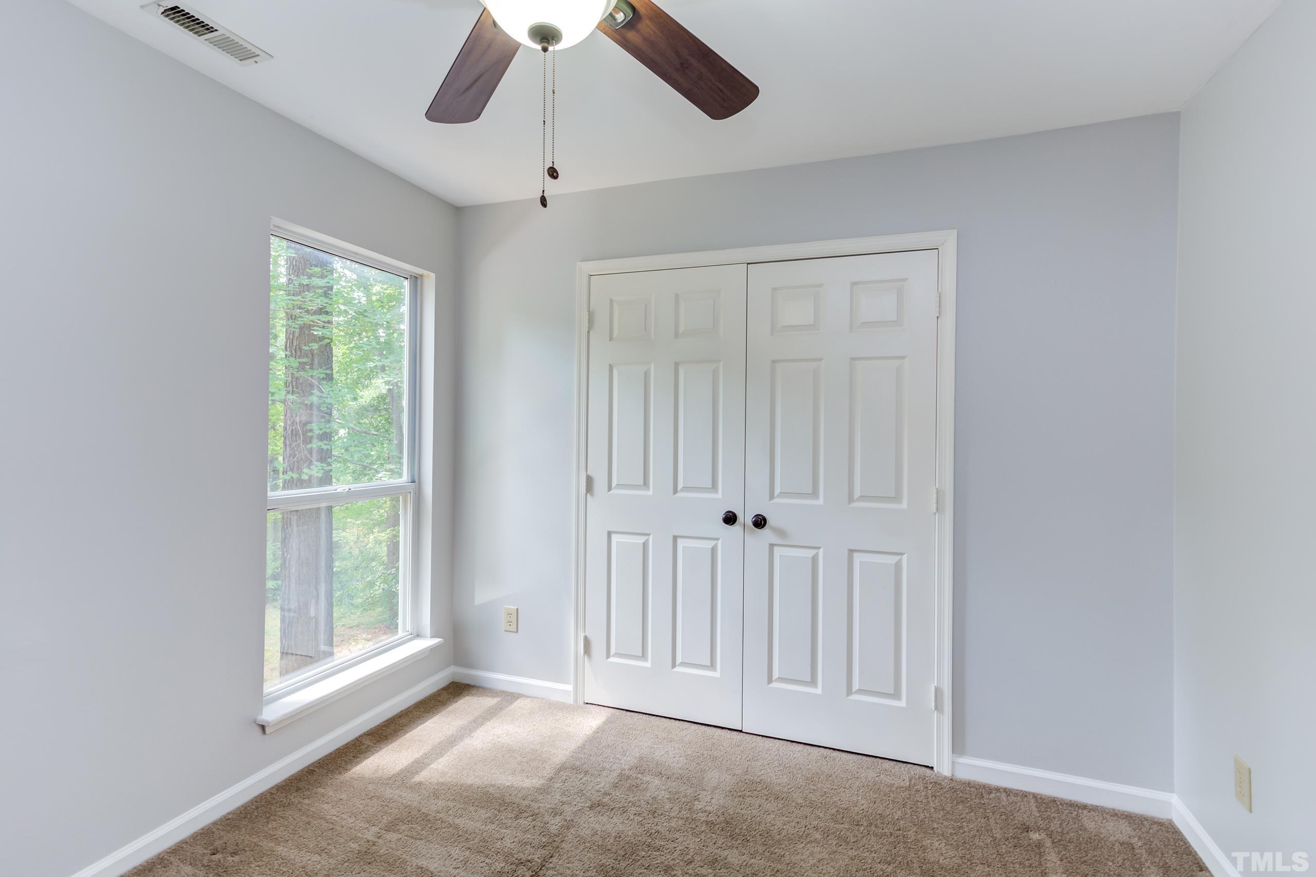 206 Eagle Tavern Drive Garner, NC 27529 - Photo 22 of 41 a view of an empty room with a window