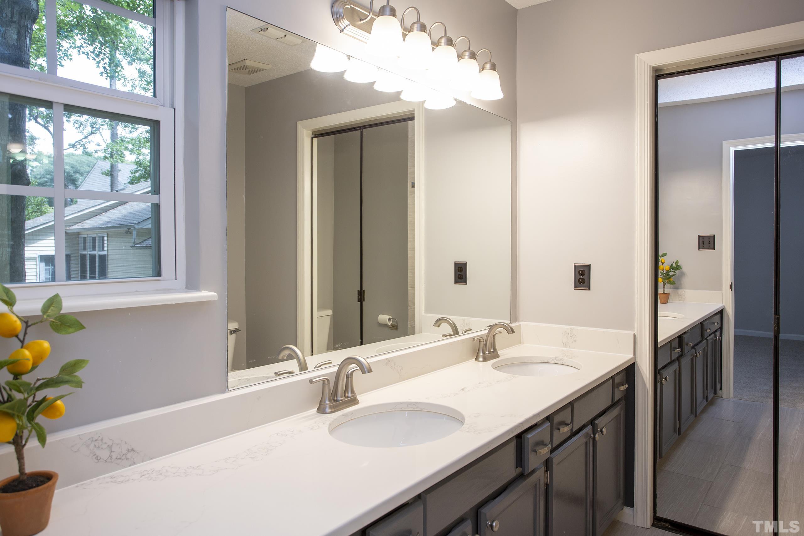 206 Eagle Tavern Drive Garner, NC 27529 - Photo 28 of 41 a bathroom with a granite countertop sink and a mirror