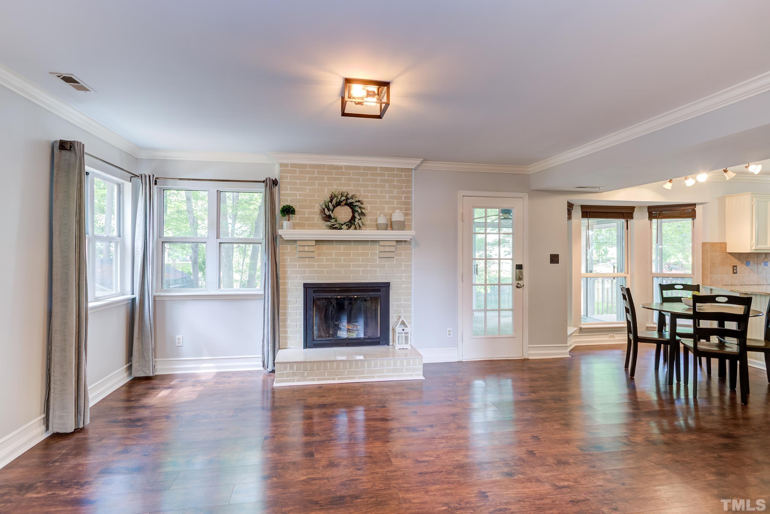 206 Eagle Tavern Drive Garner, NC 27529 - Photo 3 of 41 a view of a livingroom with furniture window and wooden floor