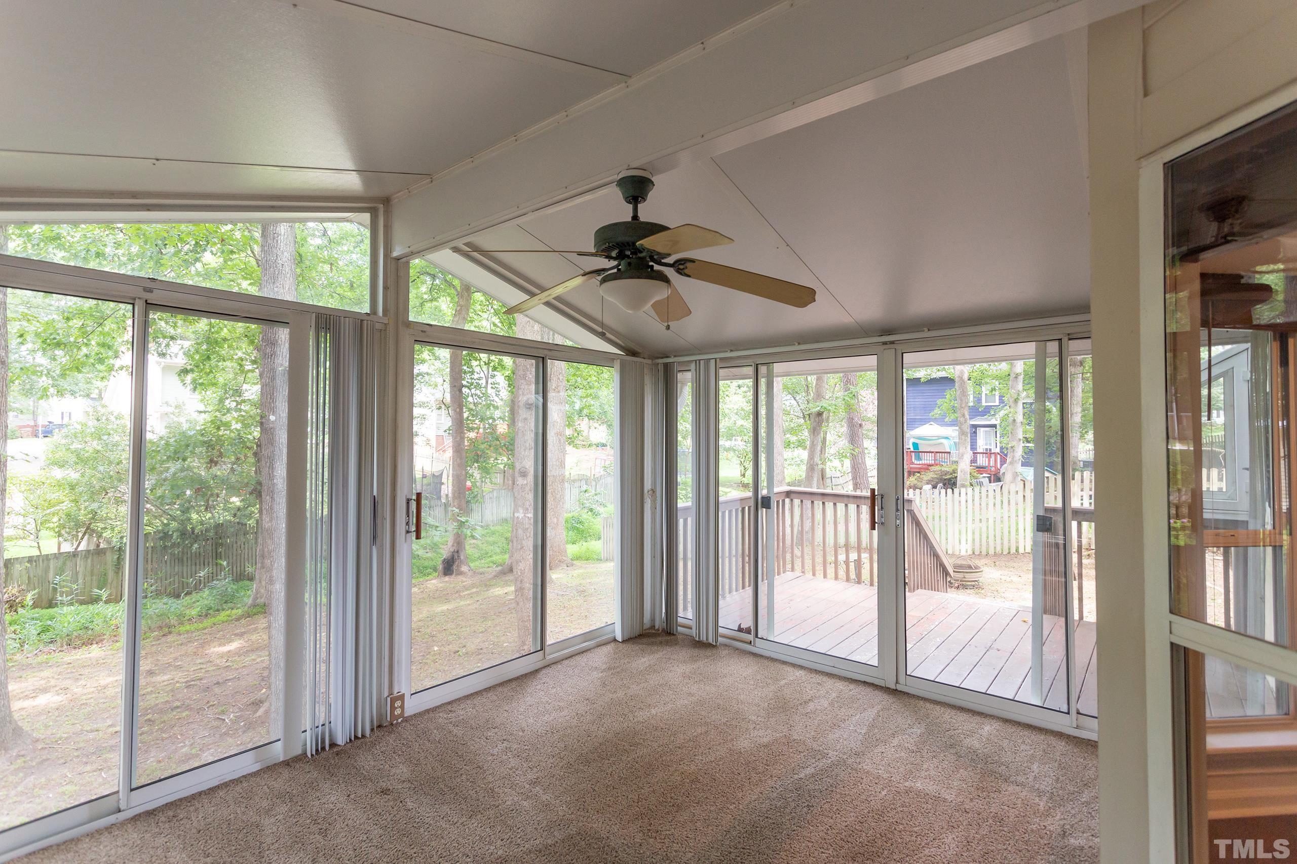 206 Eagle Tavern Drive Garner, NC 27529 - Photo 31 of 41 a view of an empty room with a floor to ceiling window