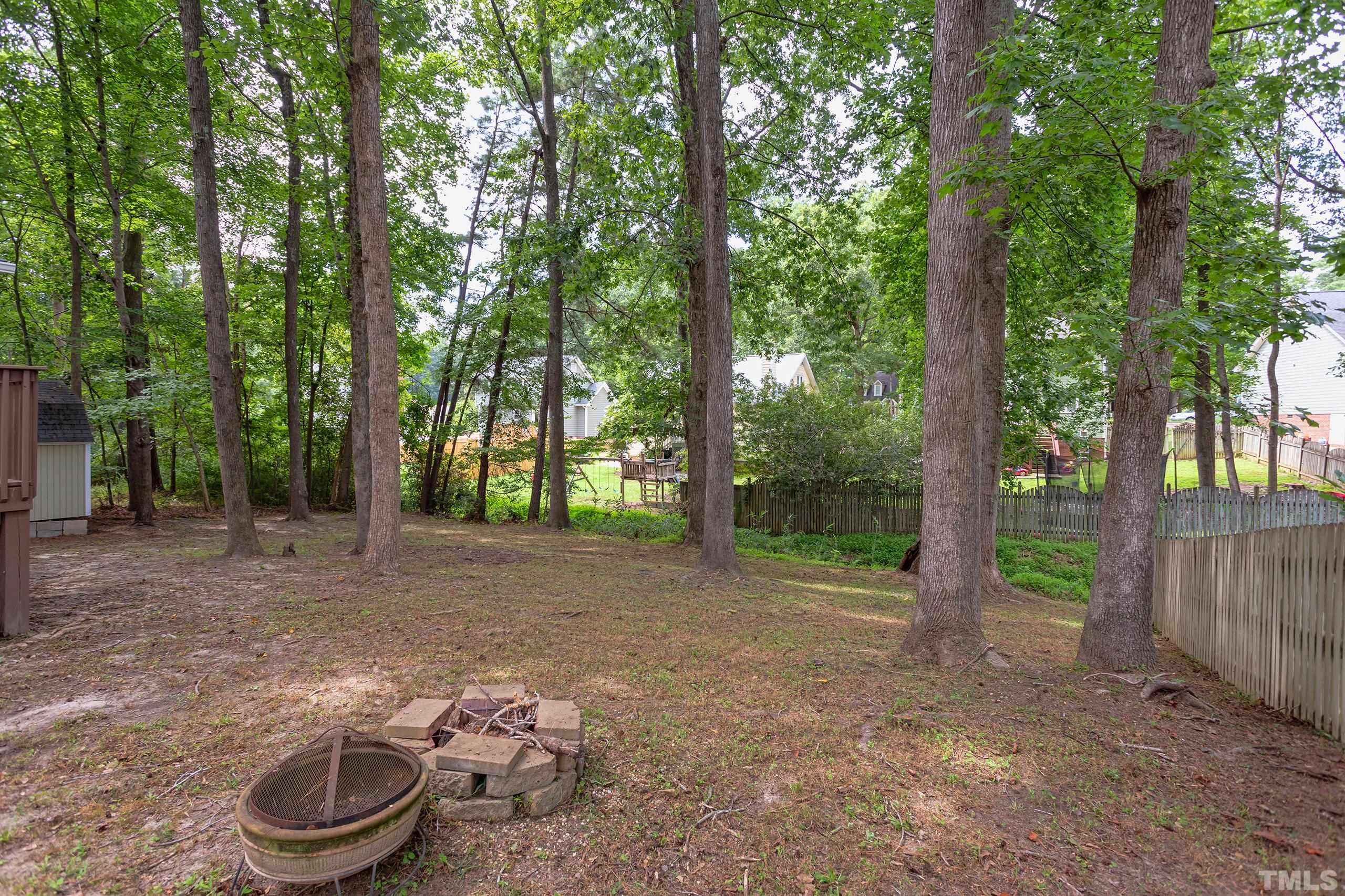 206 Eagle Tavern Drive Garner, NC 27529 - Photo 35 of 41 a backyard of a house with lots of green space and seating