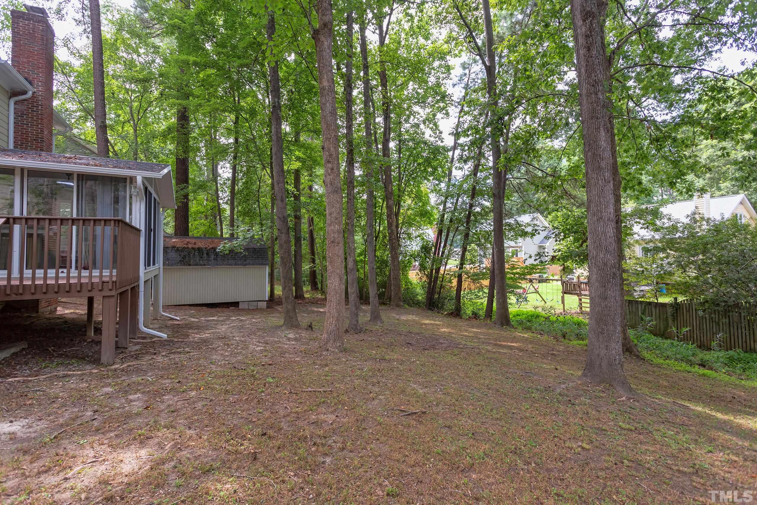 206 Eagle Tavern Drive Garner, NC 27529 - Photo 36 of 41 a view of a house with a backyard and trees