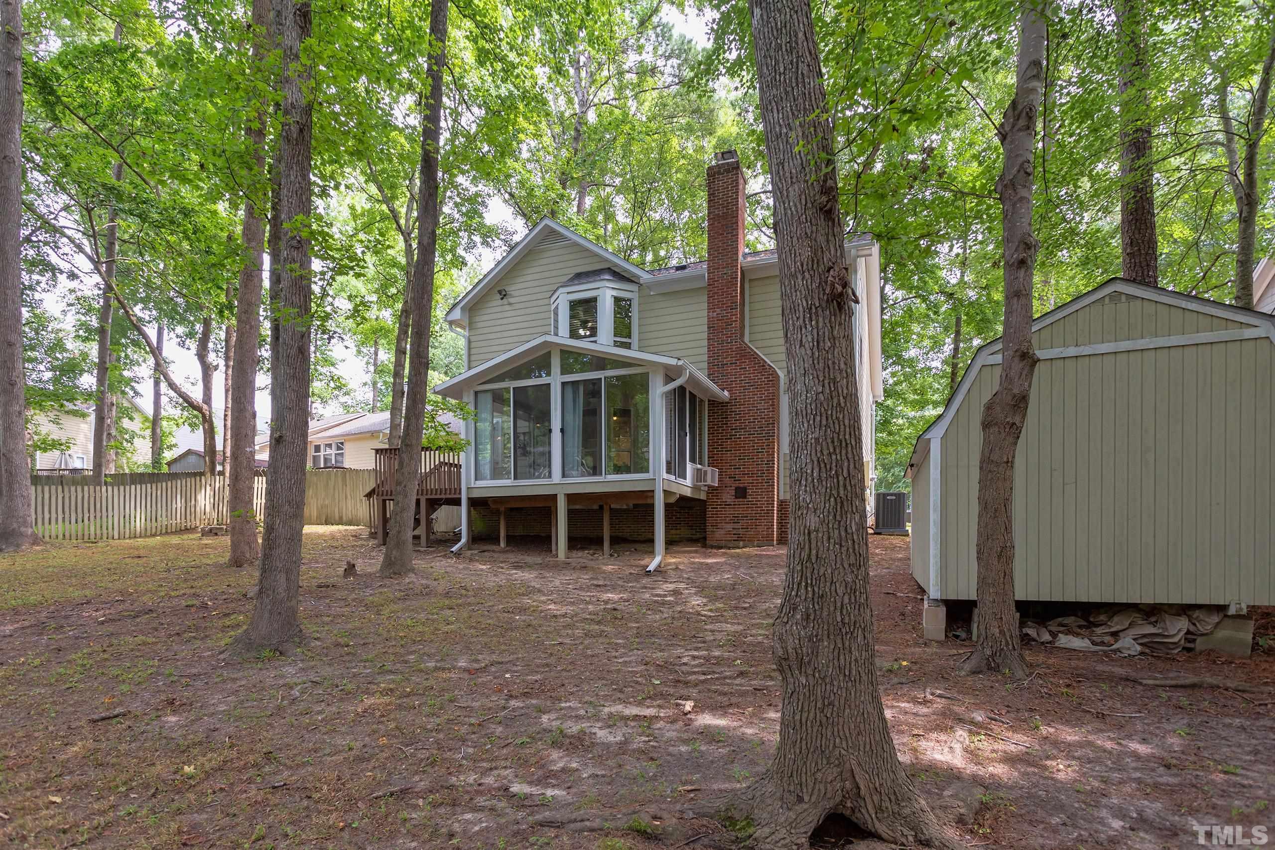 206 Eagle Tavern Drive Garner, NC 27529 - Photo 39 of 41 a backyard of a house with table and chairs