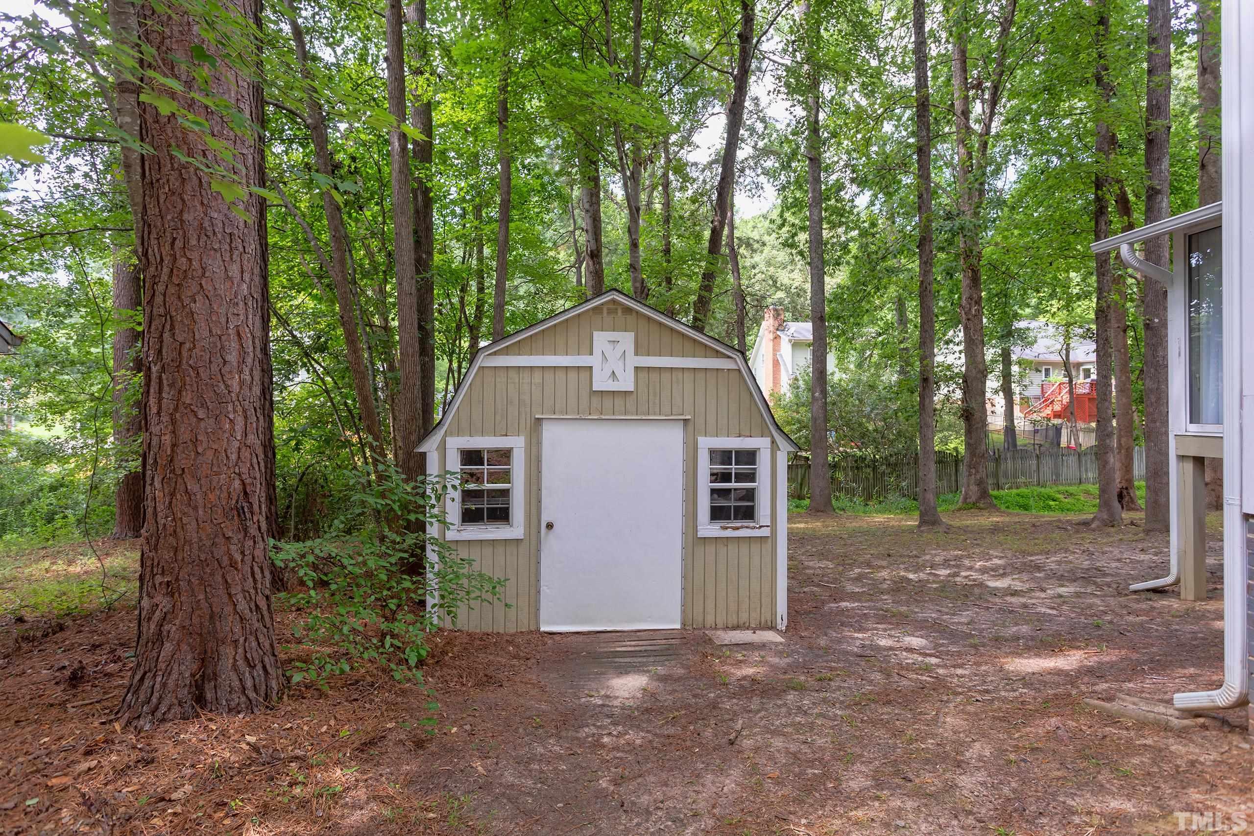 206 Eagle Tavern Drive Garner, NC 27529 - Photo 40 of 41 a view of a house with a yard and large trees