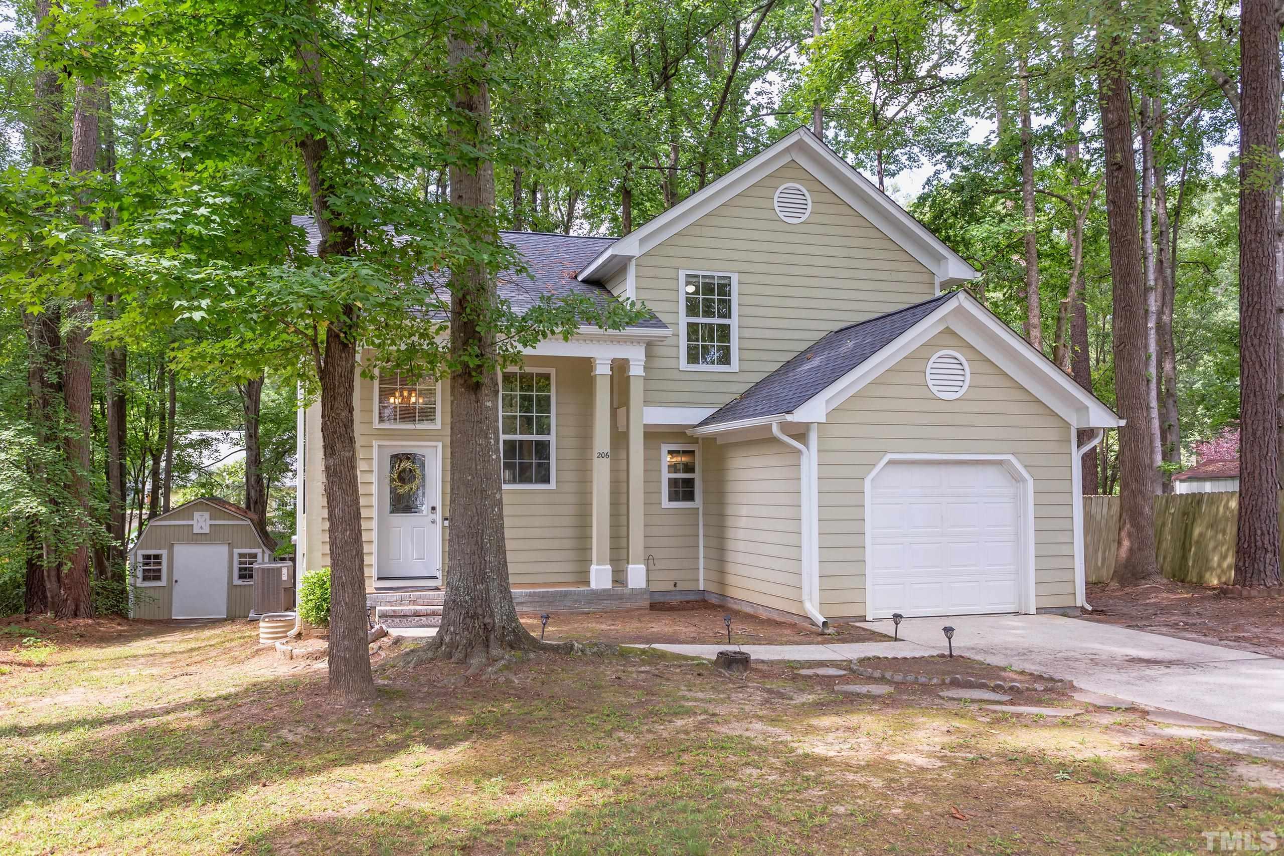 206 Eagle Tavern Drive Garner, NC 27529 - Photo 41 of 41 a view of a house with a yard and large tree