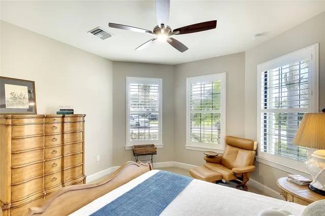 a bathroom with a granite countertop sink toilet mirror and shower