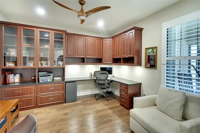 a kitchen with a sink and chairs