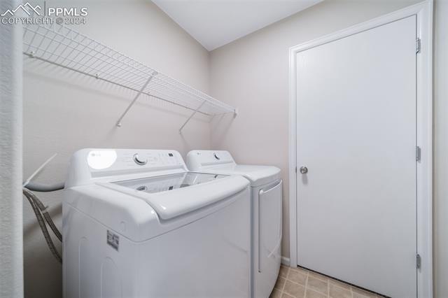 9356 Bethpage Road Peyton, CO 80831 - Photo 33 of 40 Washroom featuring separate washer and dryer