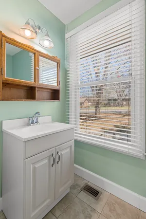 a view of a backyard door and tree