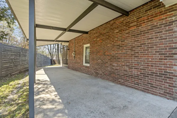 a swimming pool with trees in front of it