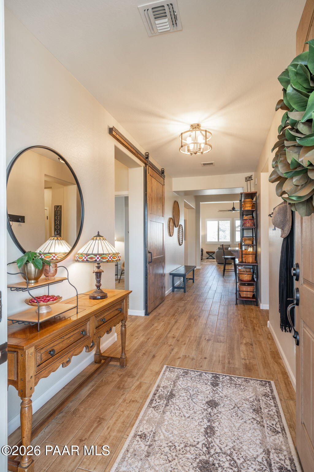 707 Lunar View Way Chino Valley, AZ 86323 - Photo 11 of 89 a living room with furniture a mirror and a flat screen tv