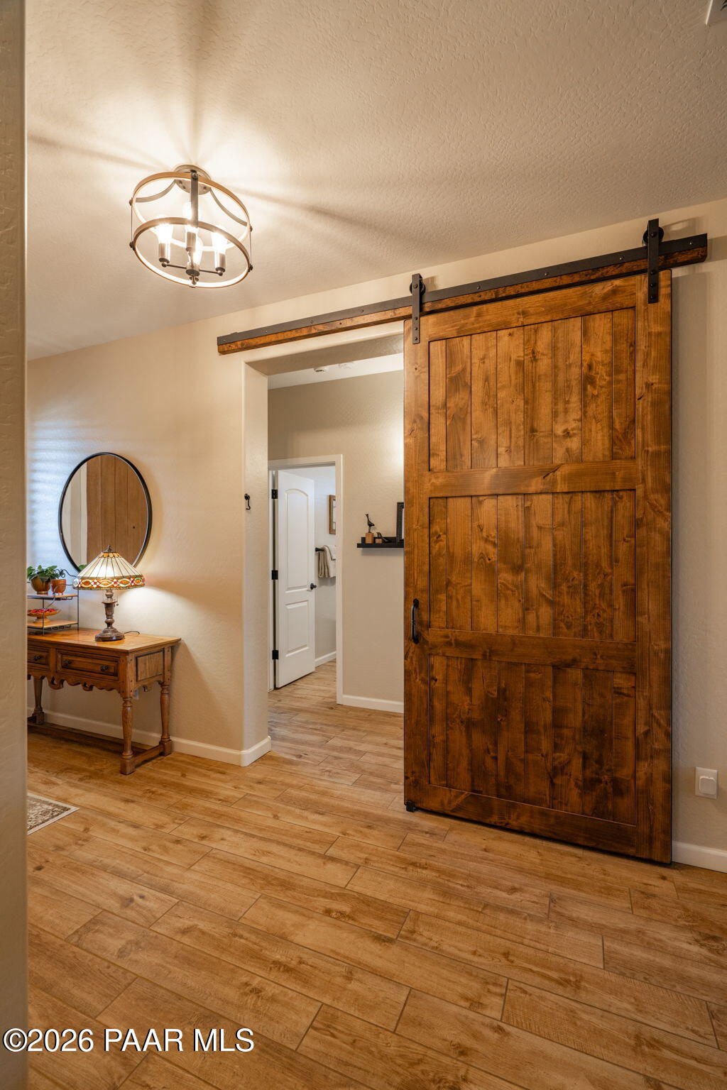 707 Lunar View Way Chino Valley, AZ 86323 - Photo 12 of 89 a view of a room with wooden floor table and chairs