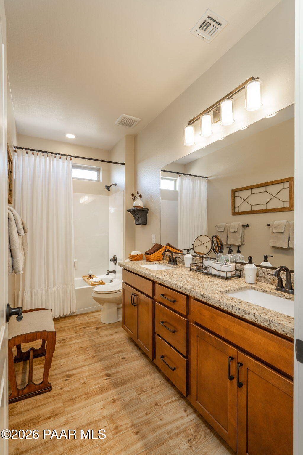 707 Lunar View Way Chino Valley, AZ 86323 - Photo 16 of 89 a large bathroom with a large mirror vanity and sink