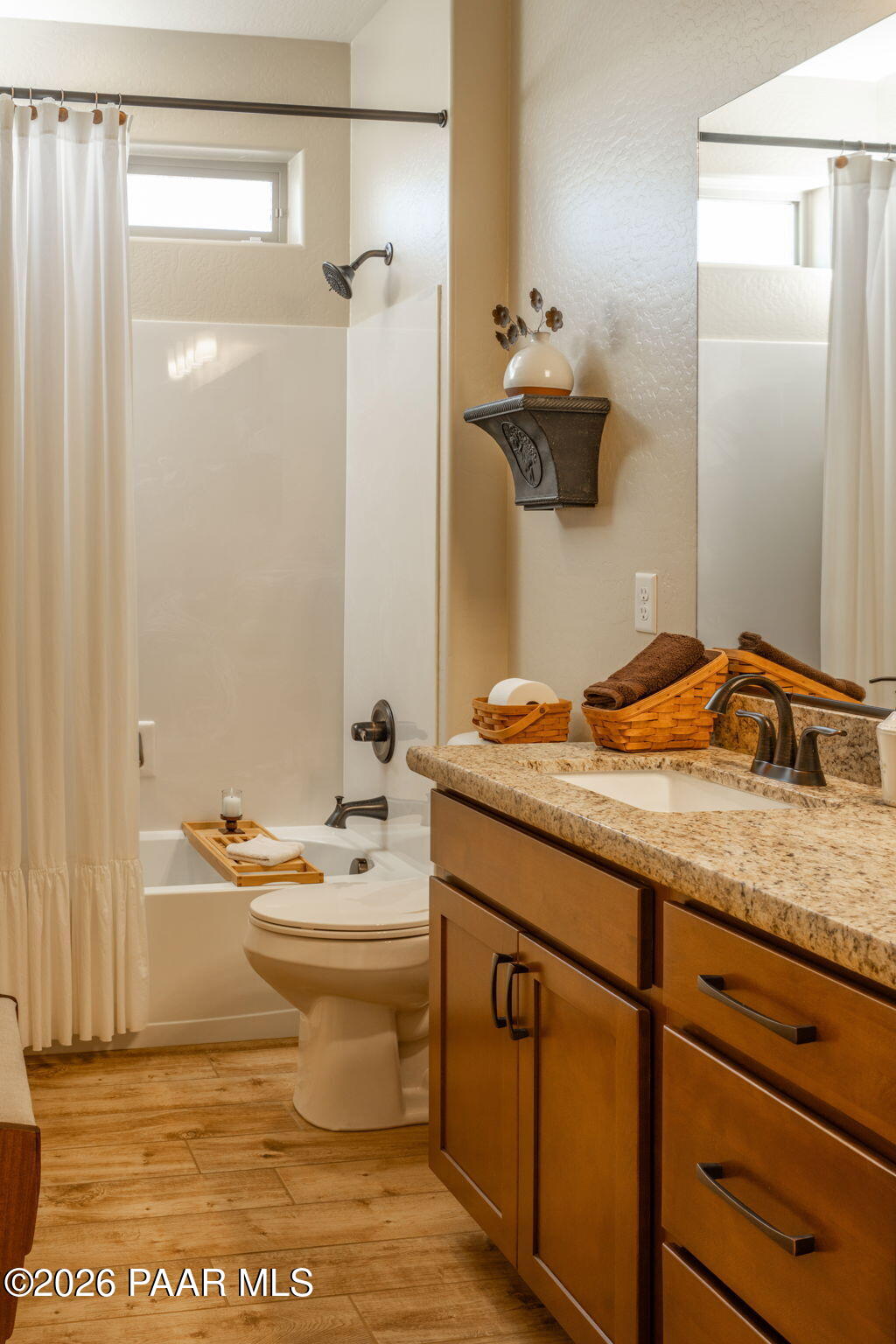 707 Lunar View Way Chino Valley, AZ 86323 - Photo 17 of 89 a bathroom with a granite countertop sink toilet and shower