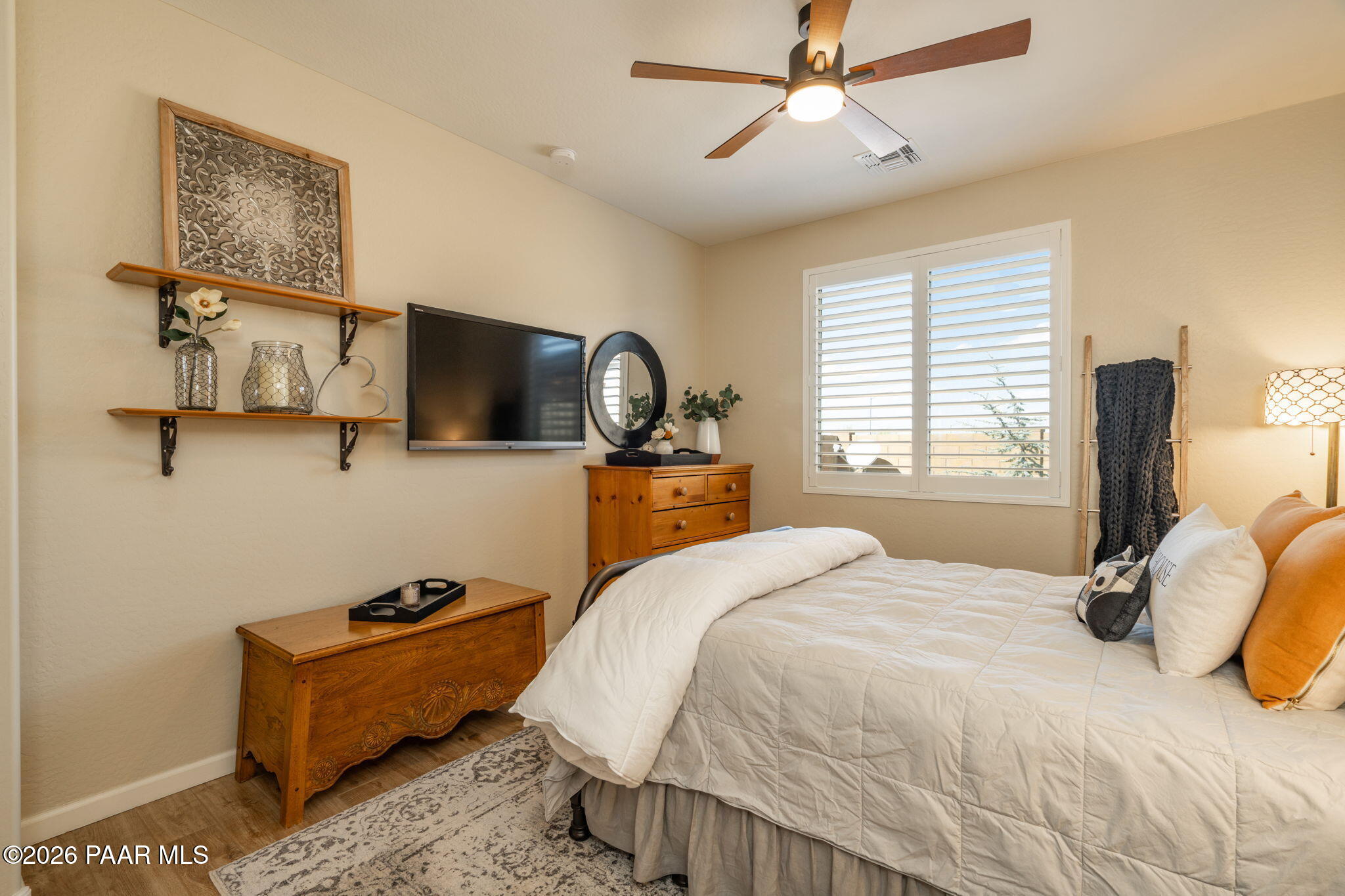 707 Lunar View Way Chino Valley, AZ 86323 - Photo 19 of 89 a bedroom with a bed window and a flat screen tv