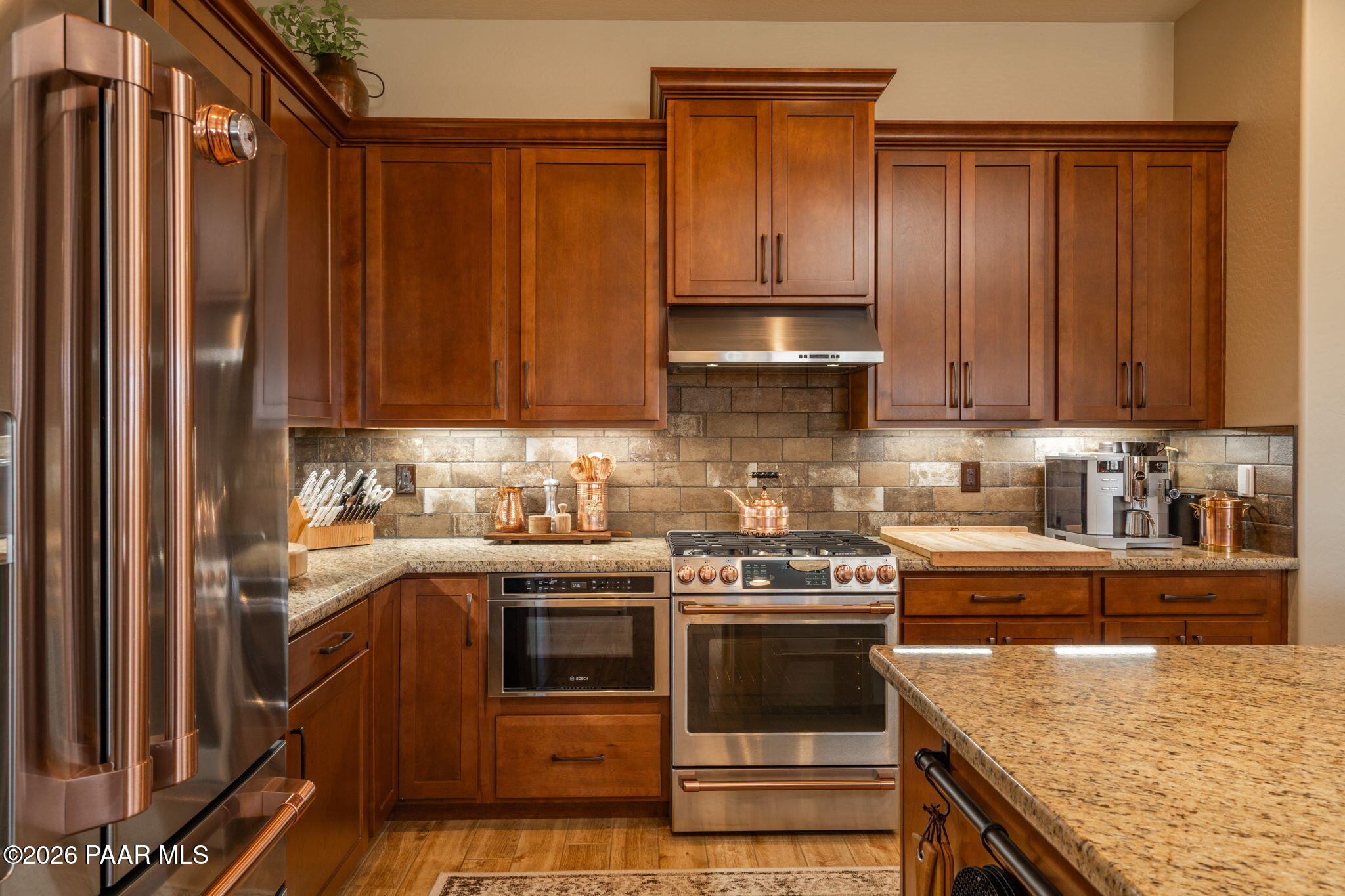 707 Lunar View Way Chino Valley, AZ 86323 - Photo 26 of 89 a kitchen with stainless steel appliances granite countertop a stove a sink and a refrigerator