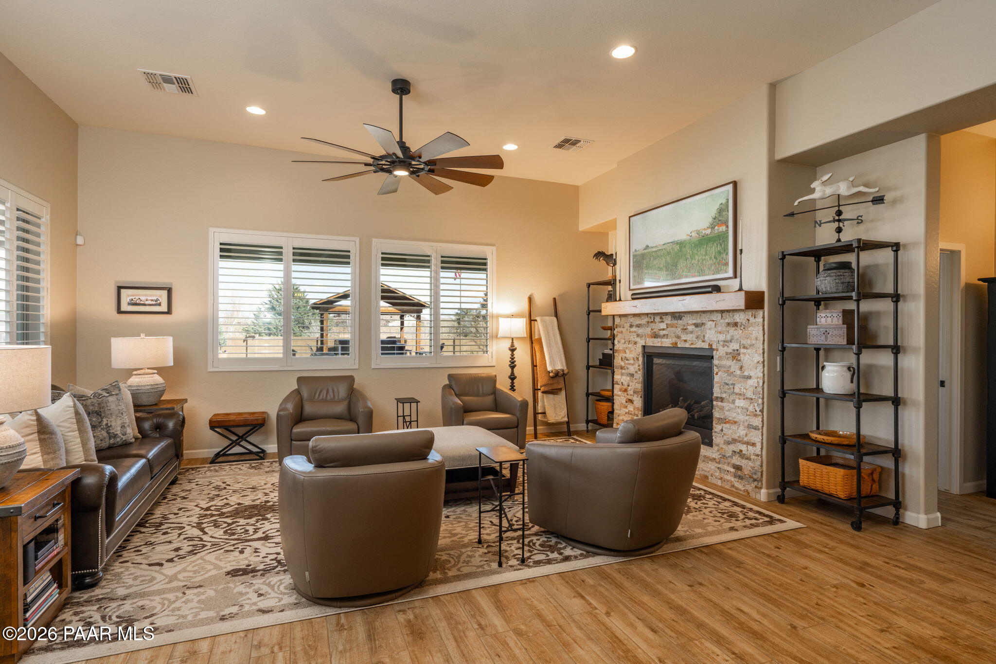 707 Lunar View Way Chino Valley, AZ 86323 - Photo 33 of 89 a living room with furniture and a fireplace