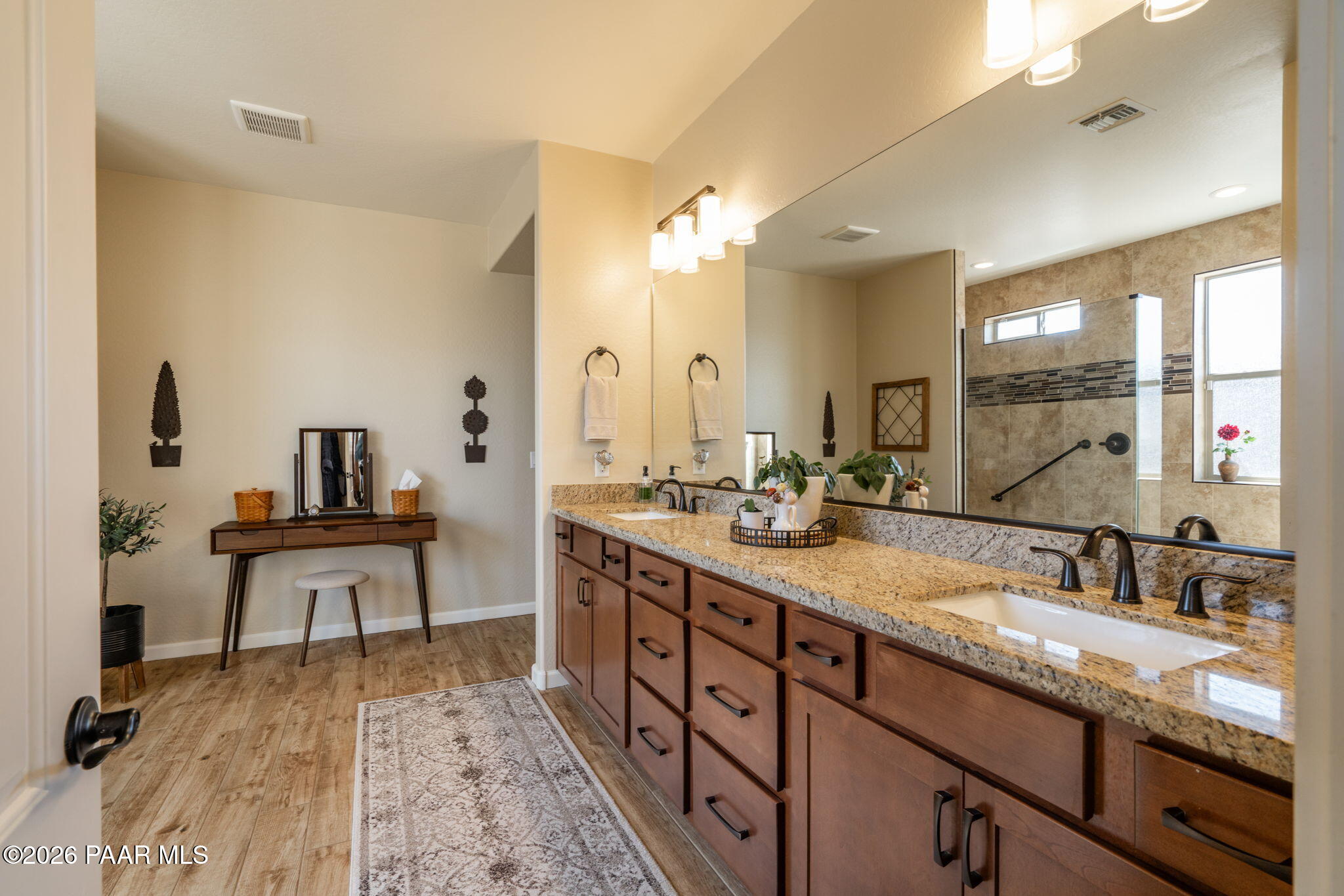 707 Lunar View Way Chino Valley, AZ 86323 - Photo 40 of 89 a spacious bathroom with a sink double vanity and a mirror