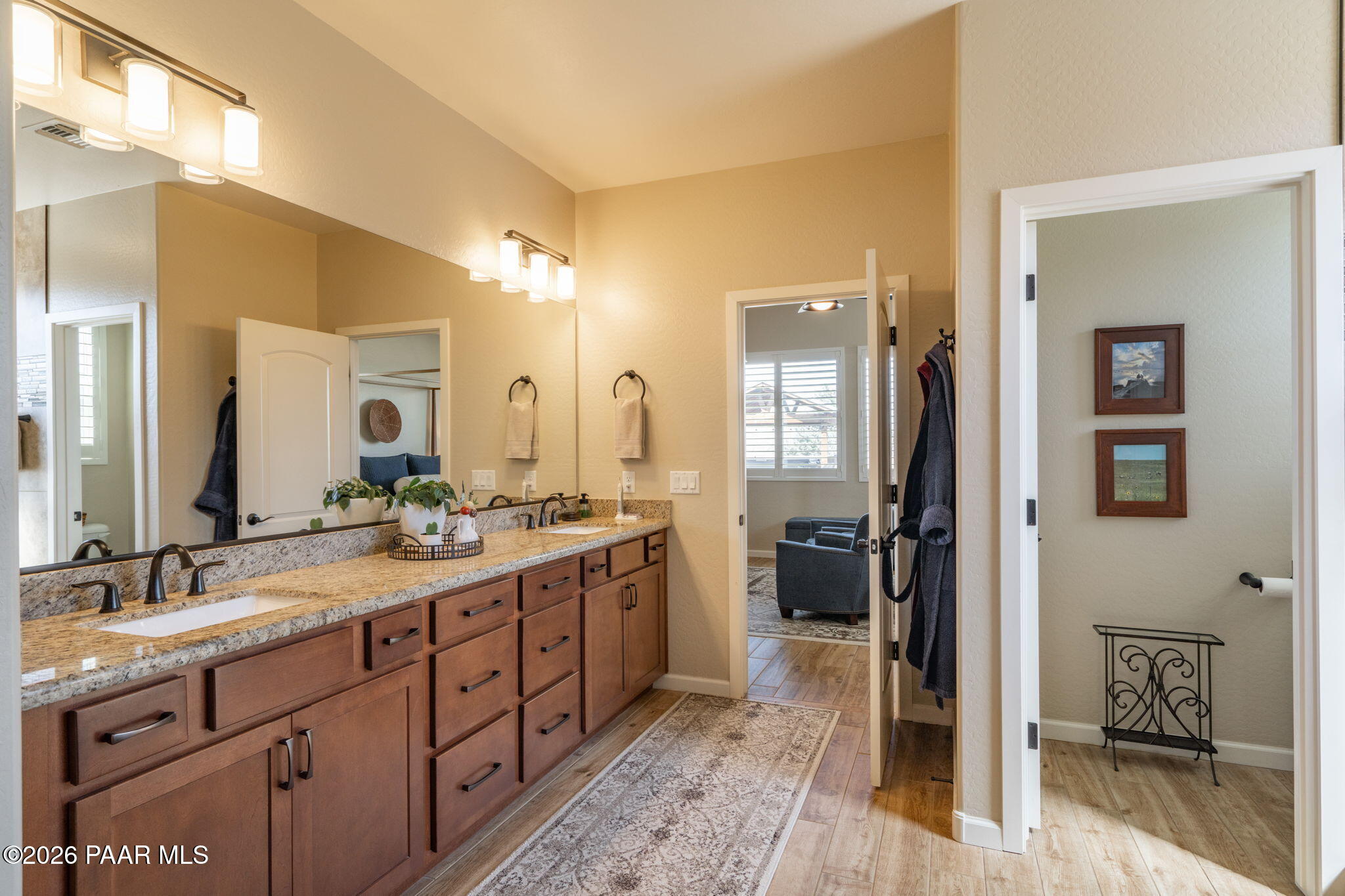 707 Lunar View Way Chino Valley, AZ 86323 - Photo 41 of 89 a spacious bathroom with a double vanity sink a mirror and a shower