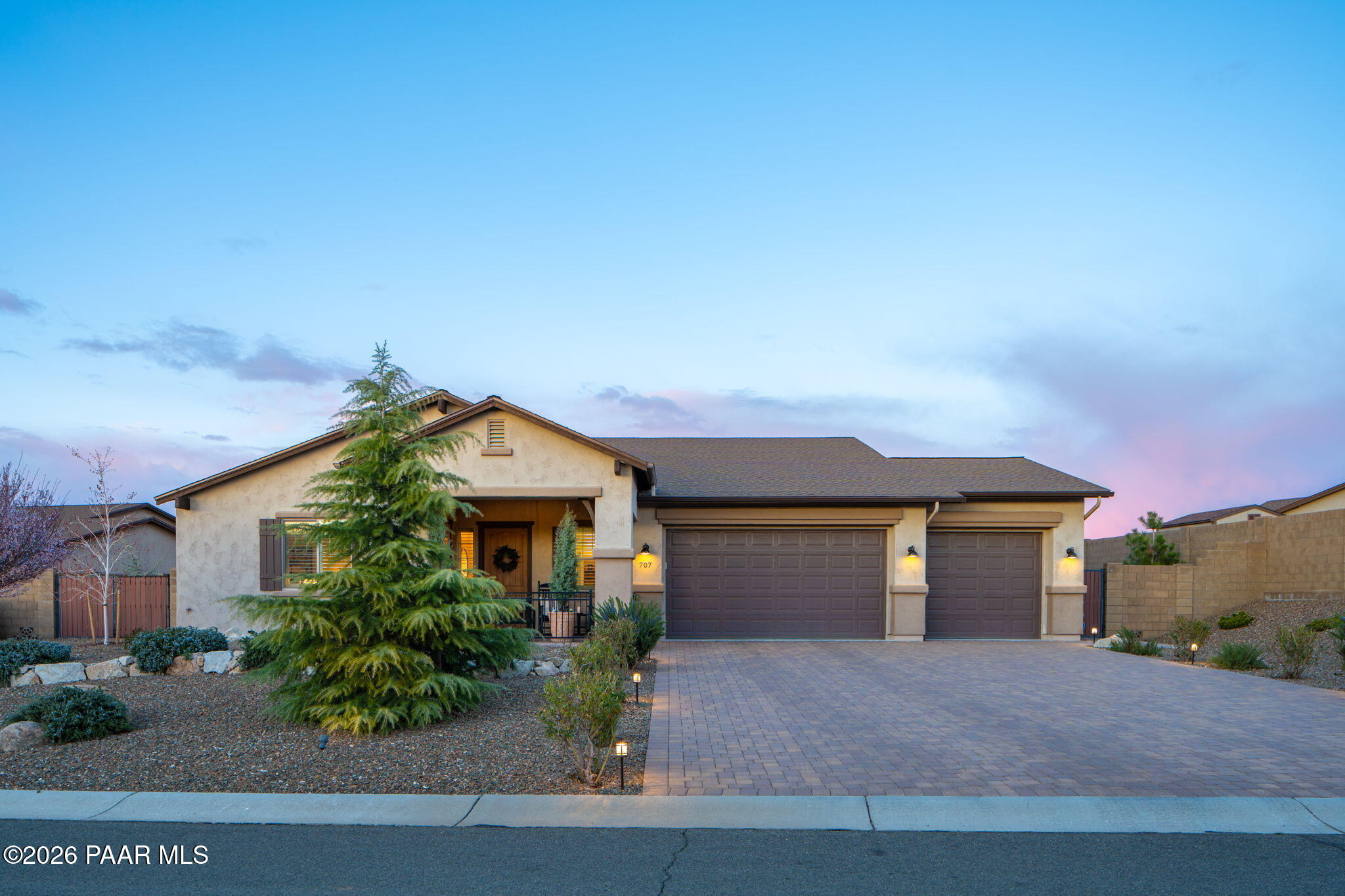 707 Lunar View Way Chino Valley, AZ 86323 - Photo 6 of 89 a front view of a house with a yard and garage