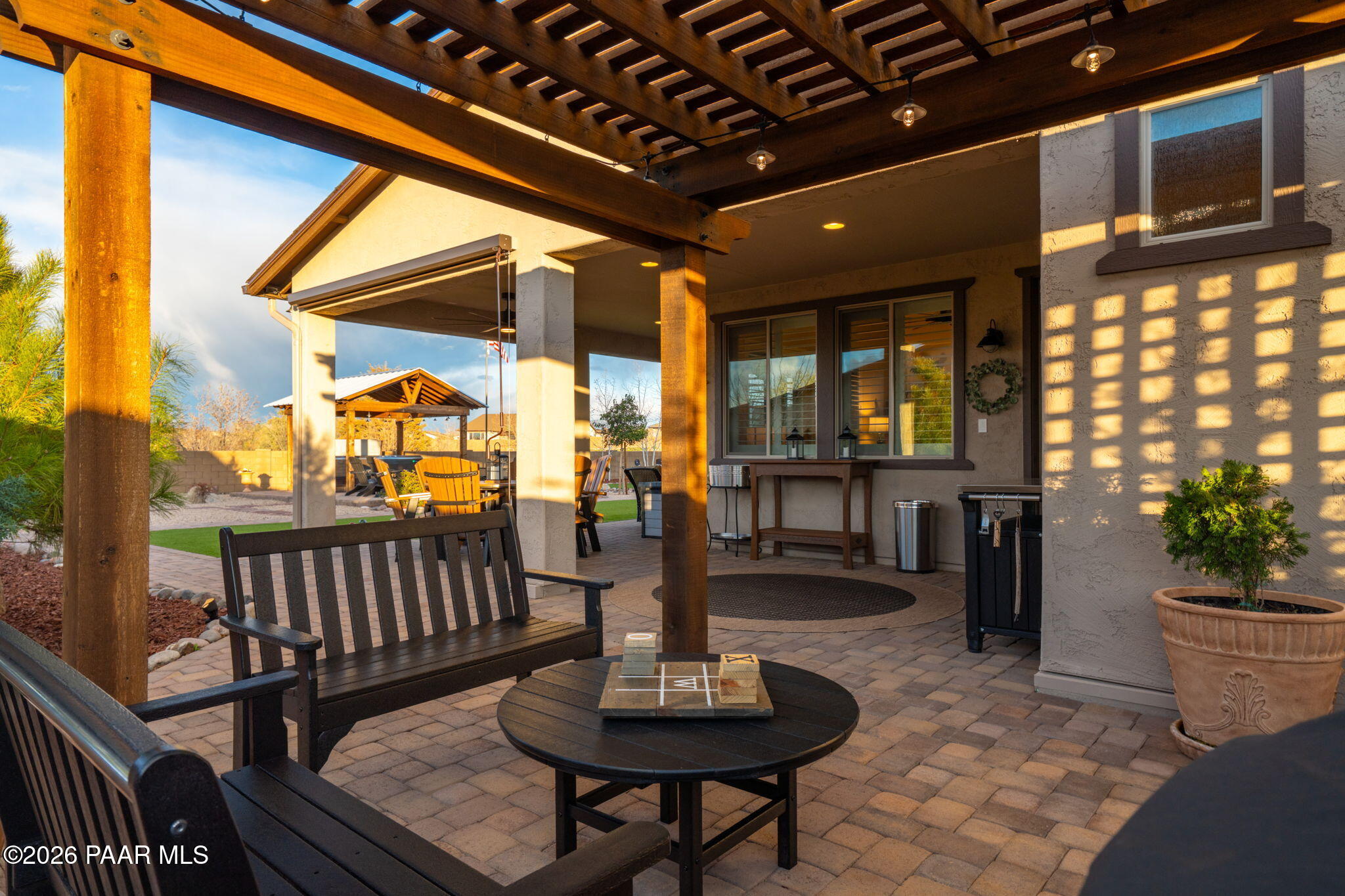 707 Lunar View Way Chino Valley, AZ 86323 - Photo 61 of 89 a view of a patio with a table and chairs and potted plants