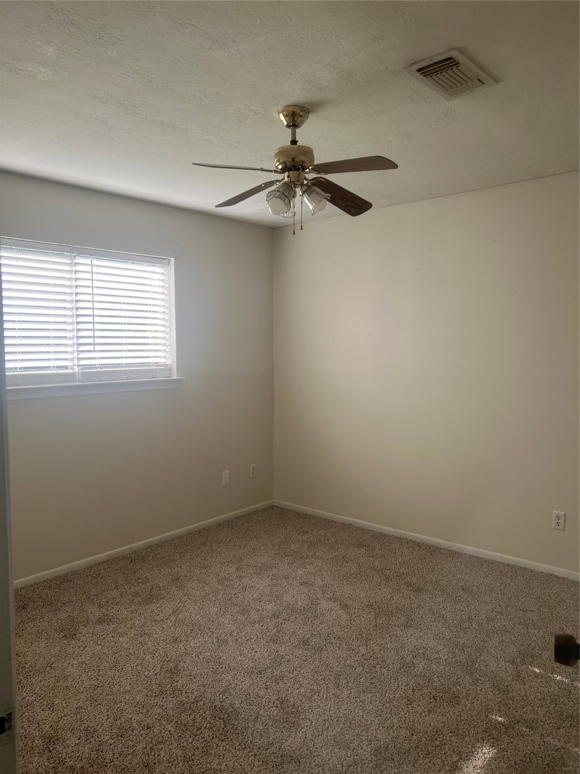 622 1/2 Coolidge Street Channelview, TX 77530 - Photo 6 of 10 an empty room with a window and a fan