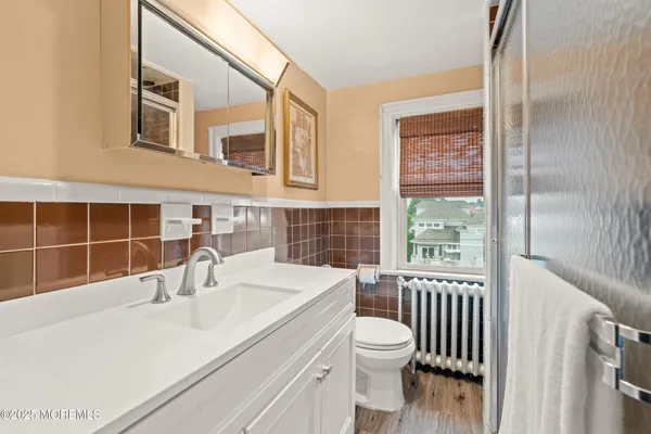 a bathroom with a sink and a large mirror