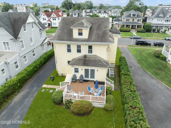 an aerial view of a house with a garden