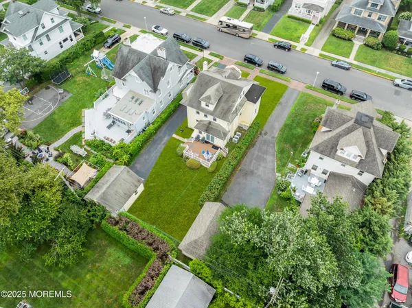 an aerial view of a house with a yard
