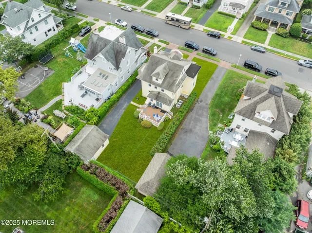 an aerial view of a house with a yard