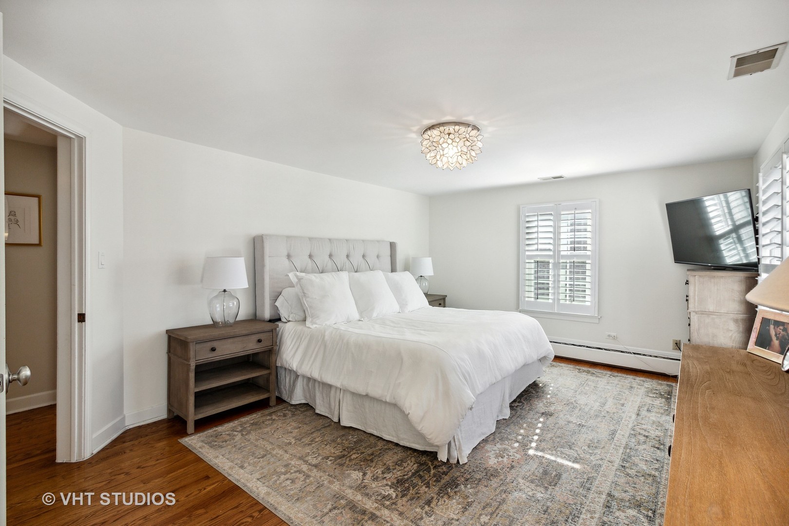 700 Juniper Road Glenview, IL 60025 - Photo 15 of 34 a bedroom with a bed and a television