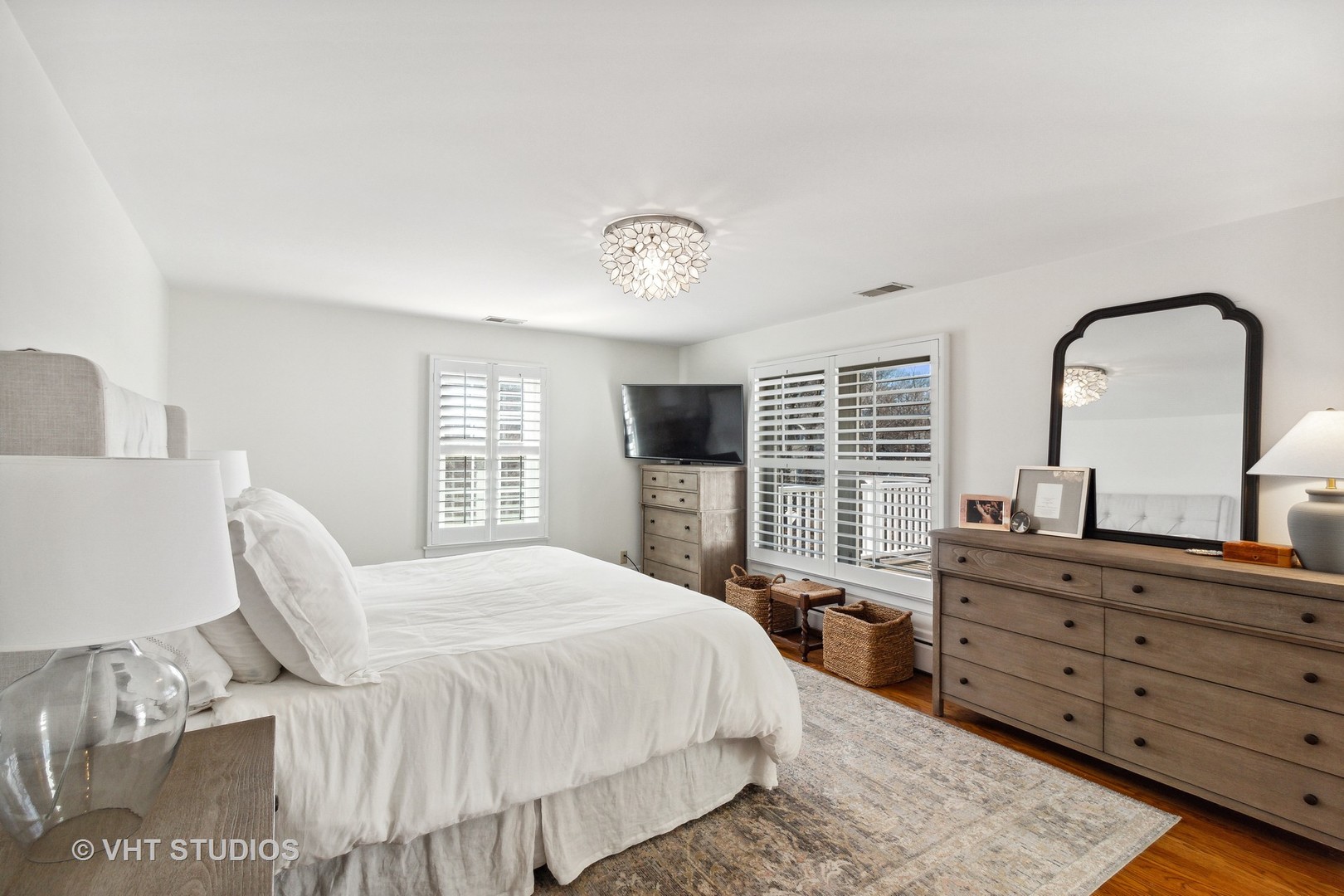 700 Juniper Road Glenview, IL 60025 - Photo 16 of 34 a bedroom with a bed and a flat screen tv