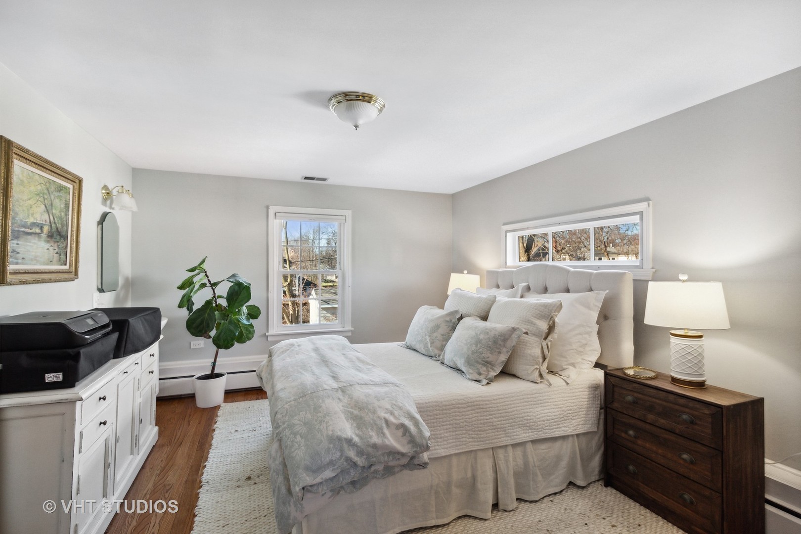 700 Juniper Road Glenview, IL 60025 - Photo 20 of 34 a bedroom with a bed and wooden floor