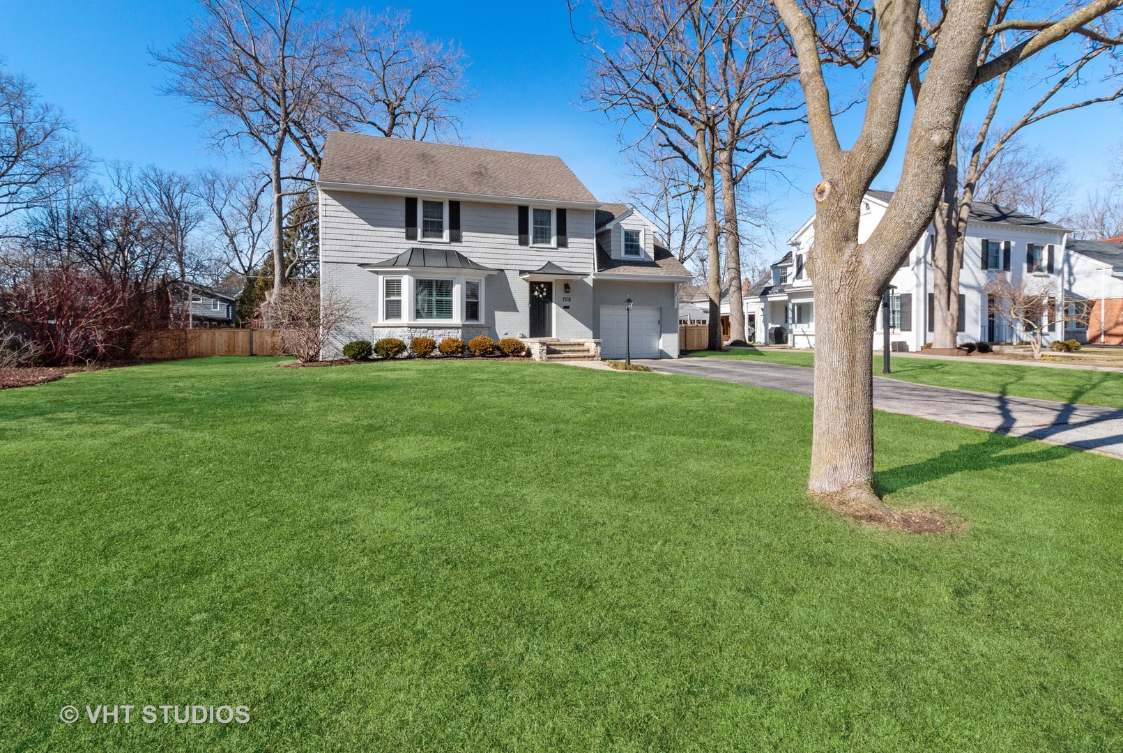 700 Juniper Road Glenview, IL 60025 - Photo 2 of 34 a front view of a house with a yard