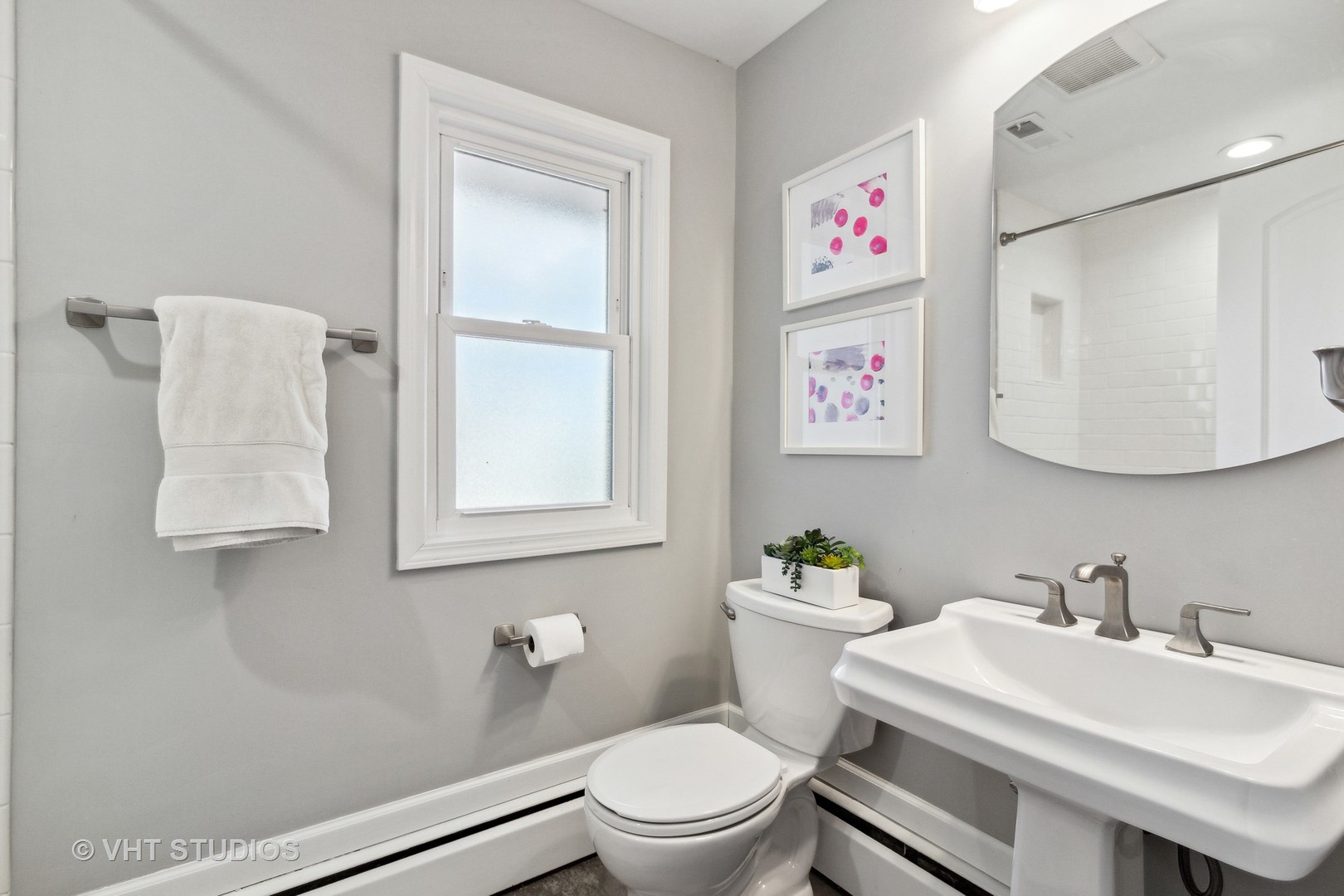 700 Juniper Road Glenview, IL 60025 - Photo 21 of 34 a bathroom with a sink a toilet and a mirror