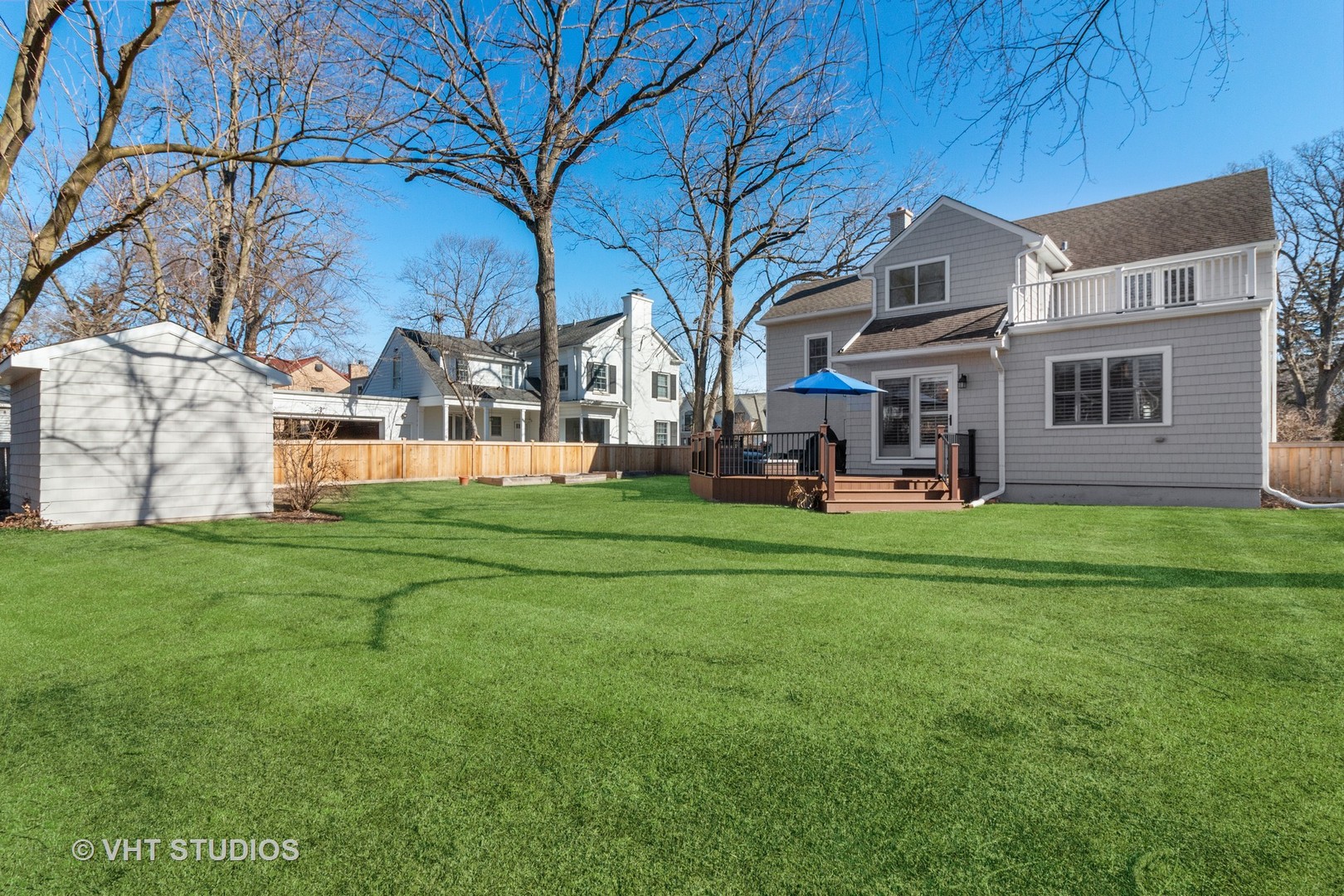 700 Juniper Road Glenview, IL 60025 - Photo 4 of 34 a front view of a house with a garden and trees